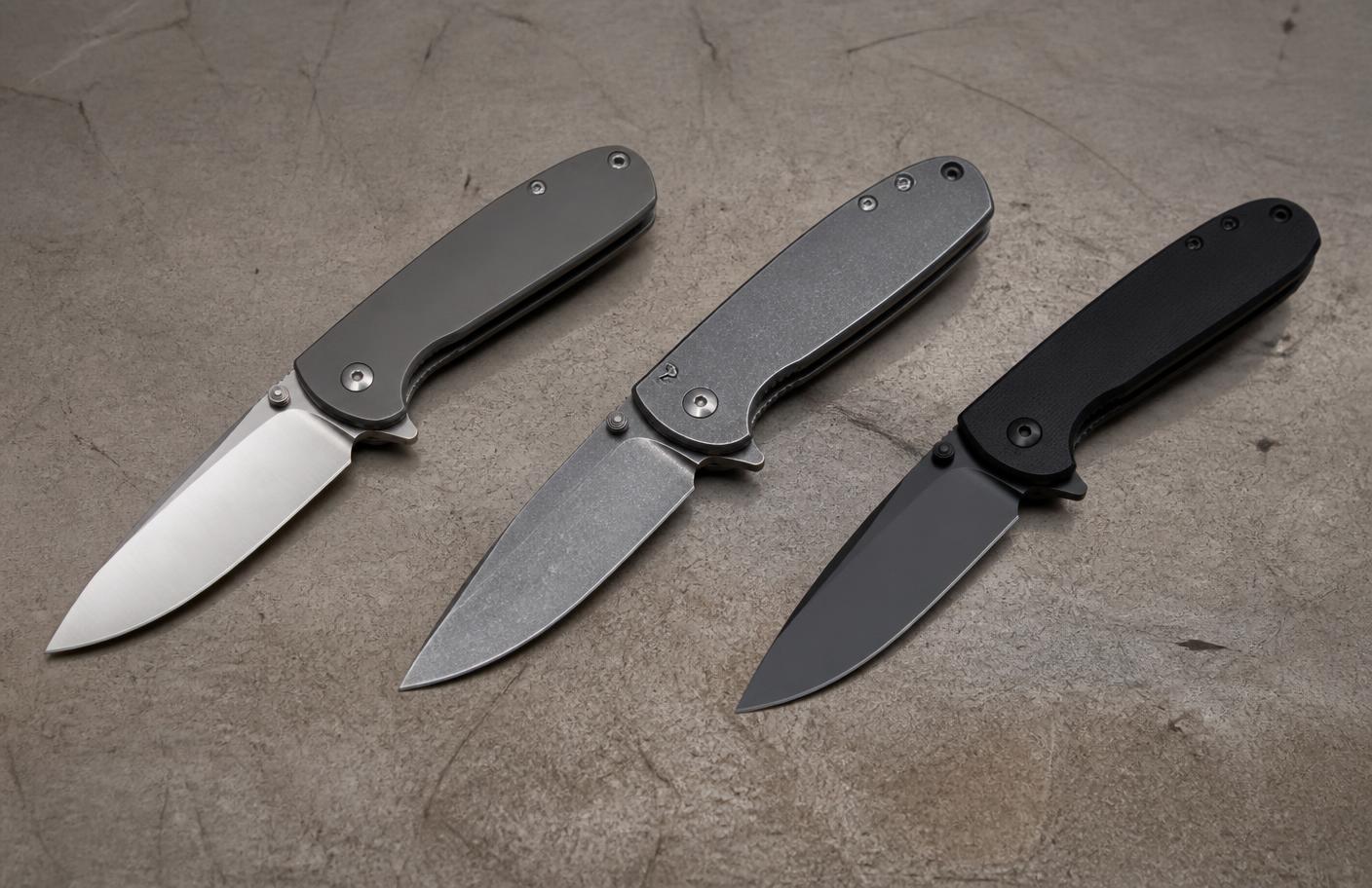 Three unbranded folding knives with satin, stonewashed and coated blades